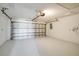 Attached garage with light grey epoxy floor at 527 Rotonda Cir, Rotonda West, FL 33947