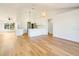 Bright kitchen features white shaker cabinets, quartz countertops, and an island at 527 Rotonda Cir, Rotonda West, FL 33947