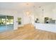 Bright and airy living room with light wood flooring at 527 Rotonda Cir, Rotonda West, FL 33947