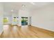 Open living room with sliding glass doors leading to the pool area at 527 Rotonda Cir, Rotonda West, FL 33947