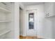 Bright and spacious pantry with white shelves at 527 Rotonda Cir, Rotonda West, FL 33947
