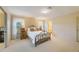 Charming bedroom with a vintage bed frame and ample closet space at 5575 Golf Pointe Dr, Sarasota, FL 34243