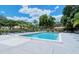 Refreshing community pool with lounge chairs and a poolside patio at 5575 Golf Pointe Dr, Sarasota, FL 34243