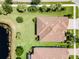 Two houses next to each other near a lake at 5610 Rain Lily Ct, Sarasota, FL 34238