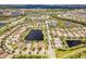 Community overview with various houses and water features at 5610 Rain Lily Ct, Sarasota, FL 34238