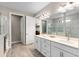 Elegant bathroom with double vanity, large shower, and linen closet at 5610 Rain Lily Ct, Sarasota, FL 34238