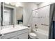 Clean bathroom with a single vanity, tub shower combo at 5610 Rain Lily Ct, Sarasota, FL 34238