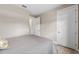 Bright bedroom with a full-size bed and adjacent bathroom at 5610 Rain Lily Ct, Sarasota, FL 34238