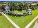 Community entrance with signage and landscaping at 5610 Rain Lily Ct, Sarasota, FL 34238