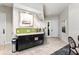 Community kitchen with dark cabinets, granite countertops, and green tile backsplash at 5610 Rain Lily Ct, Sarasota, FL 34238
