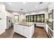 Modern community kitchen with island and appliances at 5610 Rain Lily Ct, Sarasota, FL 34238