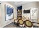 Community room with seating, bookshelves, and a TV at 5610 Rain Lily Ct, Sarasota, FL 34238
