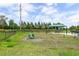 Dog park with agility equipment and shaded seating at 5610 Rain Lily Ct, Sarasota, FL 34238