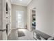 Bright and airy foyer with tile floors and French doors at 5610 Rain Lily Ct, Sarasota, FL 34238