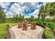 Relaxing outdoor fire pit area with seating, perfect for gatherings at 5610 Rain Lily Ct, Sarasota, FL 34238