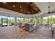 Outdoor kitchen and bar area with seating at 5610 Rain Lily Ct, Sarasota, FL 34238