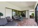 Spacious screened patio with seating and lake view at 5610 Rain Lily Ct, Sarasota, FL 34238