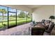 Relaxing screened patio overlooking a lake at 5610 Rain Lily Ct, Sarasota, FL 34238