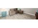 Spacious sitting area with sectional sofa and wood floors at 5610 Rain Lily Ct, Sarasota, FL 34238