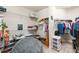 Large walk-in closet with ample shelving and hanging space at 5610 Rain Lily Ct, Sarasota, FL 34238