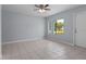 Bright living room with tile floors and large window at 5664 Kenwood Dr, North Port, FL 34287