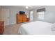 Main bedroom with carpeted floor, large bed, and ample closet space at 6018 93Rd Street E Cir, Bradenton, FL 34202