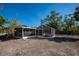 Backyard with screened-in patio area at 6536 Sabal Dr, Sarasota, FL 34242