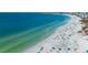 Beautiful beach with many people enjoying the sunny day at 6536 Sabal Dr, Sarasota, FL 34242