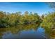 Canal lined with trees and accessible by a private dock at 6536 Sabal Dr, Sarasota, FL 34242