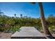 Private dock with access to a serene canal and surrounded by trees at 6536 Sabal Dr, Sarasota, FL 34242