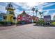 Quaint coastal shops and businesses with lighthouse-style architecture and parking at 6536 Sabal Dr, Sarasota, FL 34242