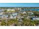 Aerial perspective of home, showcasing its location along a canal and surrounding foliage at 6536 Sabal Dr, Sarasota, FL 34242