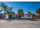 Front exterior of a single-story home with a carport and palm trees at 6536 Sabal Dr, Sarasota, FL 34242