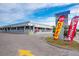 Exterior view of Lenny's Pizza and Island Bar with prominent signage and open flags at 6536 Sabal Dr, Sarasota, FL 34242