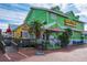 Brightly colored waterfront restaurant and ice cream shop with accessible ramps at 6536 Sabal Dr, Sarasota, FL 34242