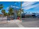 Clayton's Siesta Grille sign with restaurant in the background at 6536 Sabal Dr, Sarasota, FL 34242
