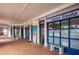 Covered walkway with various shops including a salon, deli, and silver store at 6536 Sabal Dr, Sarasota, FL 34242