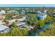 An aerial view highlighting the home's waterfront location on a tranquil canal at 6536 Sabal Dr, Sarasota, FL 34242