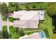 Bird's eye view of a home with a tiled roof and pool at 7708 Camminare Dr, Sarasota, FL 34238