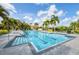 Community lap pool with lounge chairs and patio area at 7708 Camminare Dr, Sarasota, FL 34238