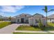 Single-Gathering home with paver driveway and landscaping at 12515 Galapagos Ct, Venice, FL 34293