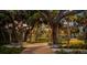 Landscaped park with winding pathways and lush foliage at dusk at 1305 4Th St # 502A, Sarasota, FL 34236