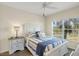 Bright bedroom with a queen-size bed and ensuite bath at 2060 Willow Hammock Cir # 304, Punta Gorda, FL 33983