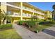 Building exterior showcasing the well-maintained landscaping and building facade at 2060 Willow Hammock Cir # 304, Punta Gorda, FL 33983