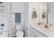 Clean bathroom with shower/tub combo, vanity, and updated fixtures at 2320 Lindstrom St, Sarasota, FL 34237