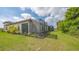 Home with screened patio and expansive grassy backyard at 26903 Pavin Dr, Englewood, FL 34223