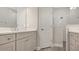 Elegant bathroom with a double vanity, quartz countertop, and a shower at 26903 Pavin Dr, Englewood, FL 34223