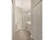 Clean bathroom with double vanity, shower, and ample closet space at 26903 Pavin Dr, Englewood, FL 34223
