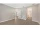 Spacious bedroom with wood-look floors, offering access to other rooms at 26903 Pavin Dr, Englewood, FL 34223