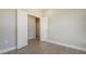 Bright bedroom with double doors and light grey walls at 26903 Pavin Dr, Englewood, FL 34223